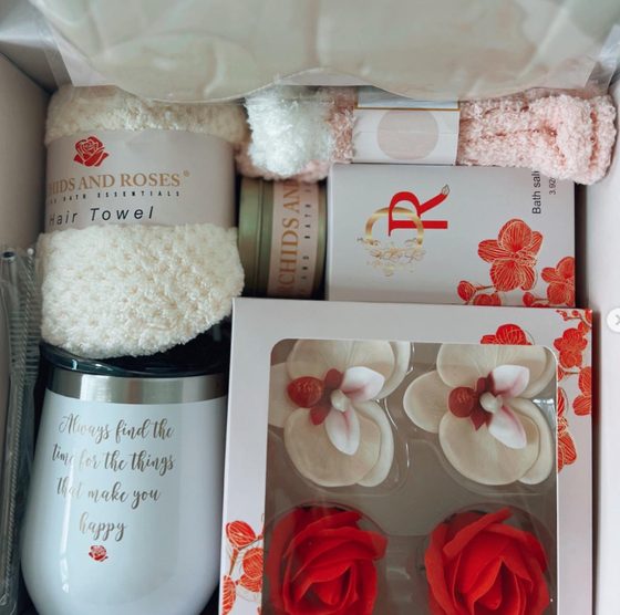 Contents of a self-care gift box arranged in its packaging